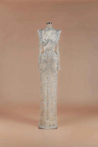 Sihëna Silver Scallop — silver high-neck long-sleeve column gown with scalloped crystal-pearl beadwork on sheer nude tulle.