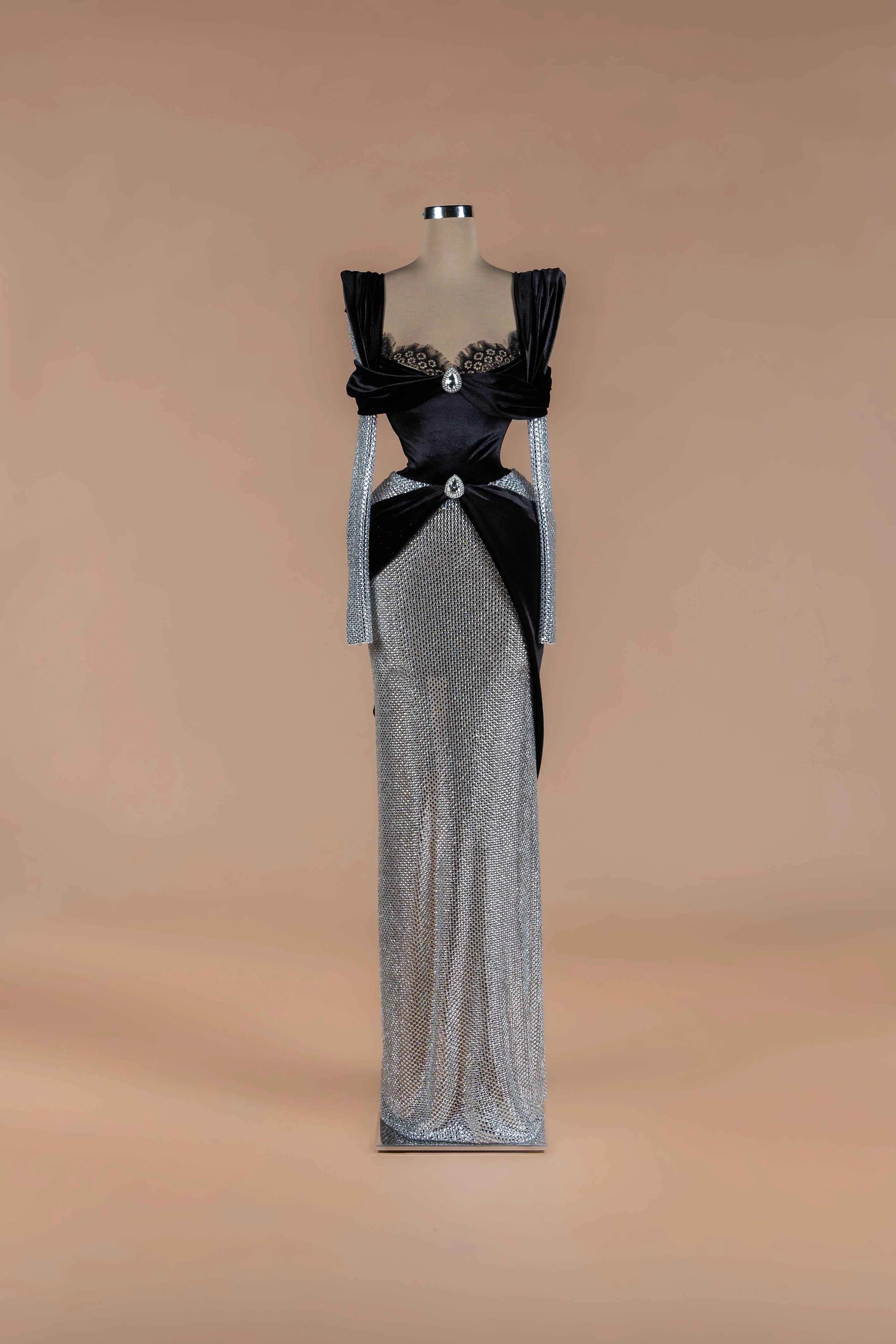 Sihëna Onyx Duality — black off-shoulder sweetheart velvet bodice with lace trim, crystal brooches and a silver crystal-mesh skirt.