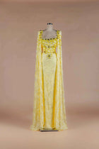 Sihëna Citrine Heirloom — marigold square-neckline lace column gown with crystal-and-bead floral stones and lace cape panels.