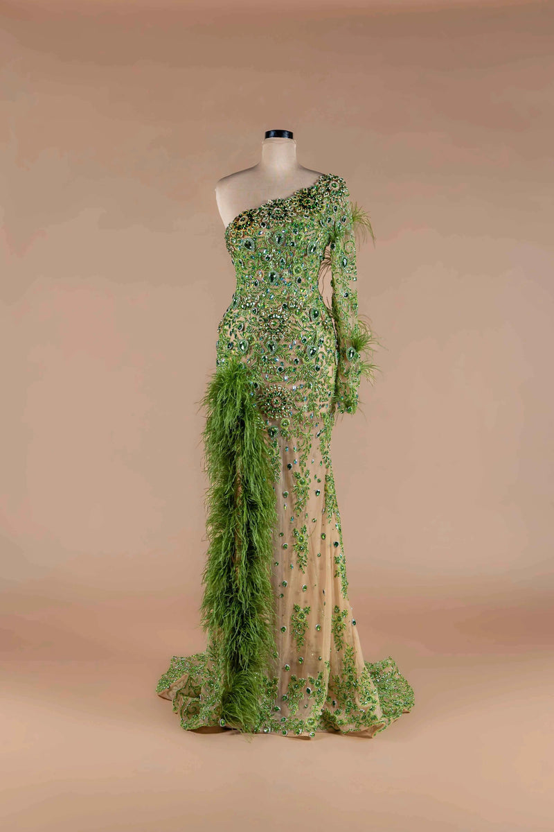 Sihëna Peridot Plume — lime one-shoulder single-sleeve mermaid gown with green crystal beadwork and feather boa trim.