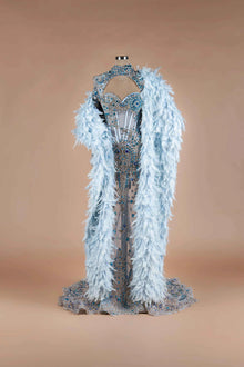 Sihëna Glacial Splendor — powder-blue sweetheart mermaid gown with blue crystal corset, high-neck keyhole collar and feather cape.