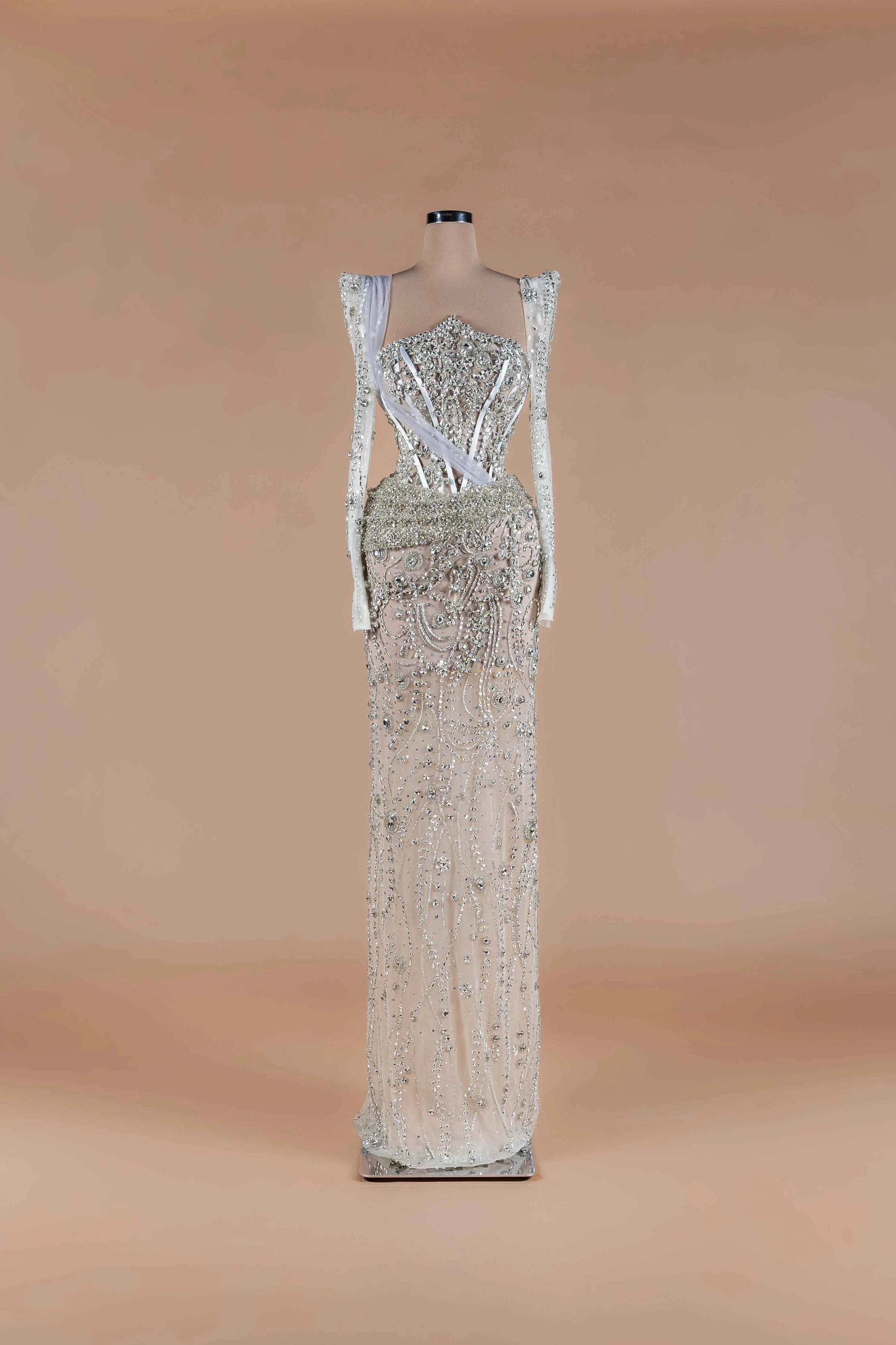 Sihëna Diamond Reverie — silver sweetheart long-sleeve column gown with crystal corset bodice and all-over beadwork.