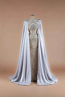 Sihëna Silver Reign — silver high-neck column gown with crystal-beaded sheer bodice and flowing satin cape train.