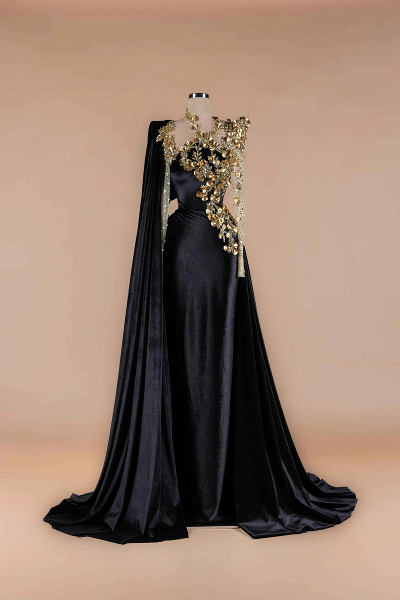 Sihëna Noir Blossom Crown — black high-neck long-sleeve velvet mermaid gown with gold 3D-floral appliqué, crystal beadwork and cape train.