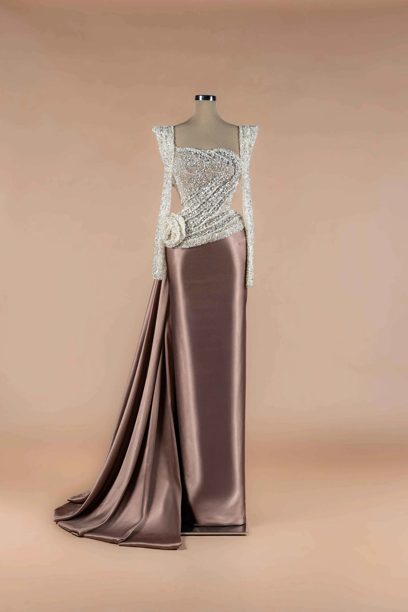 Sihëna Taupe Rosette — taupe square-neckline long-sleeve column gown with silver crystal-beaded bodice, draped sash rosette and satin train.