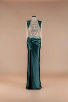 Sihëna Emerald Jewel Crest — emerald high-neck long-sleeve mermaid gown with crystal-beaded sheer bodice and twist-draped satin skirt.