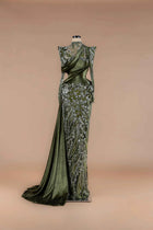 Sihëna Olive Brocade — olive high-neck long-sleeve velvet gown with silver-beaded floral appliqué, draped sash and high slit.