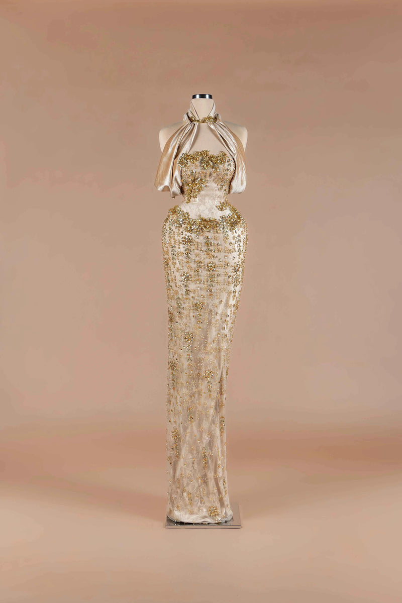 Sihëna Halcyon Shimmer — champagne strapless beaded-lace column gown with draped velvet neck wrap and crystal floral appliqué.