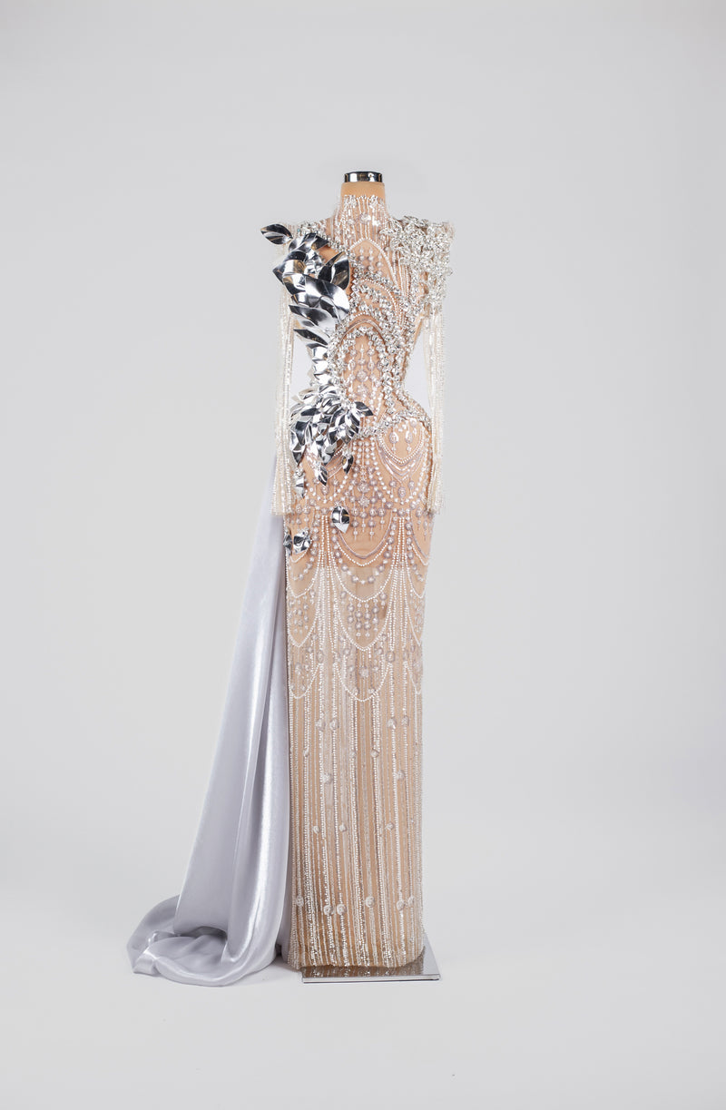 Sihëna Mirrored Pearl Marquee — silver high-neck long-sleeve gown with pearl drapes, mirrored metallic florals and satin overskirt.