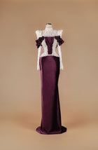 Sihëna Plum Pearl Citadel — burgundy high-neck long-sleeve velvet column gown with pearl and crystal beaded sheer bodice and ruffled shoulders.