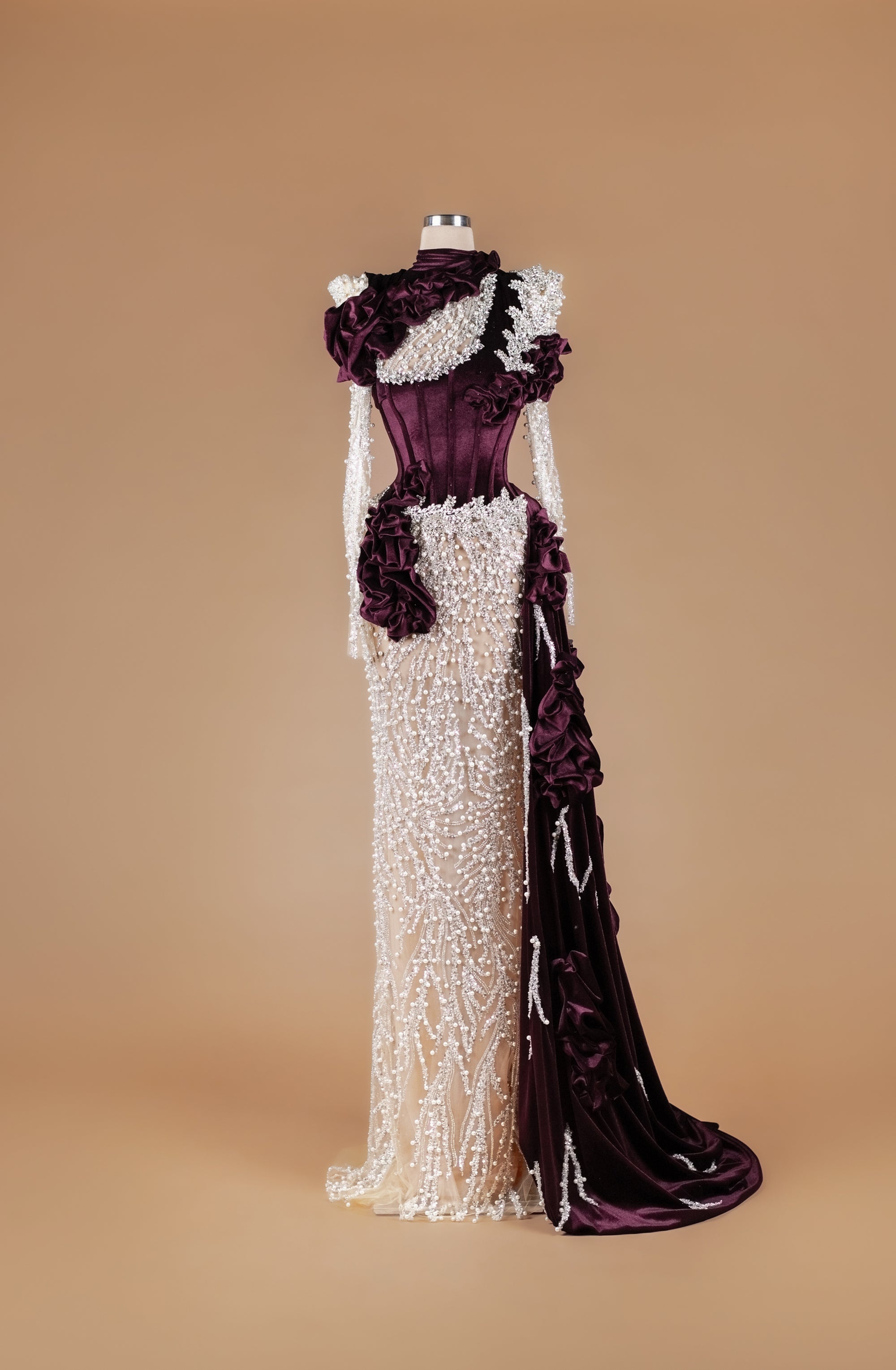 Sihëna Amaranth Pearl Opus — burgundy high-neck long-sleeve mermaid gown with velvet corset, pearl and crystal beadwork and draped velvet sash train.