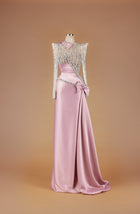 Sihëna Opaline Ribbon Sonnet — blush high-neck long-sleeve A-line gown with crystal and pearl beaded sheer bodice, satin bow and draped satin train.