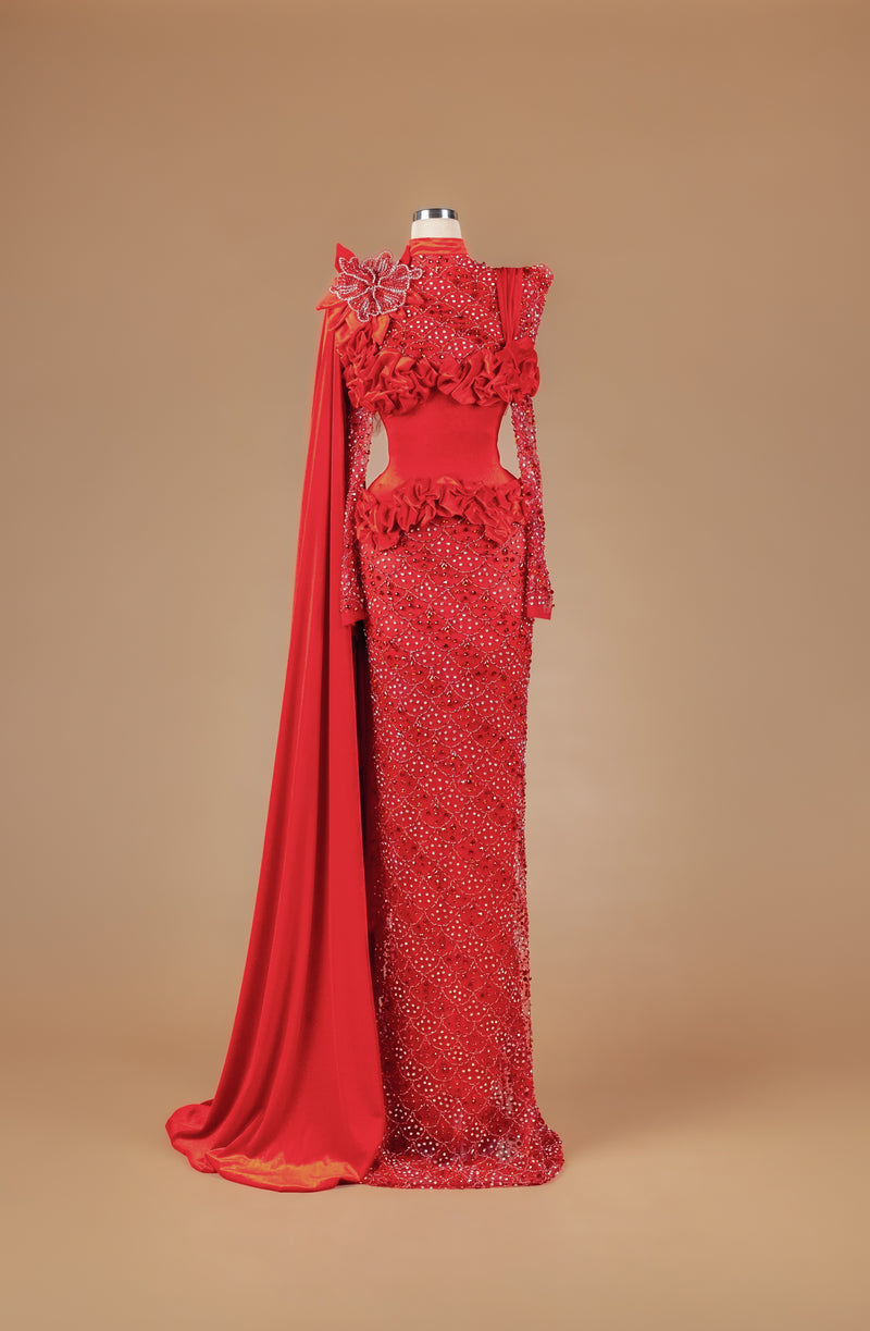 Sihëna Pomegranate Court Bloom — red high-neck long-sleeve column gown with crystal beadwork, 3D floral appliqué, ruffles and draped cape train.