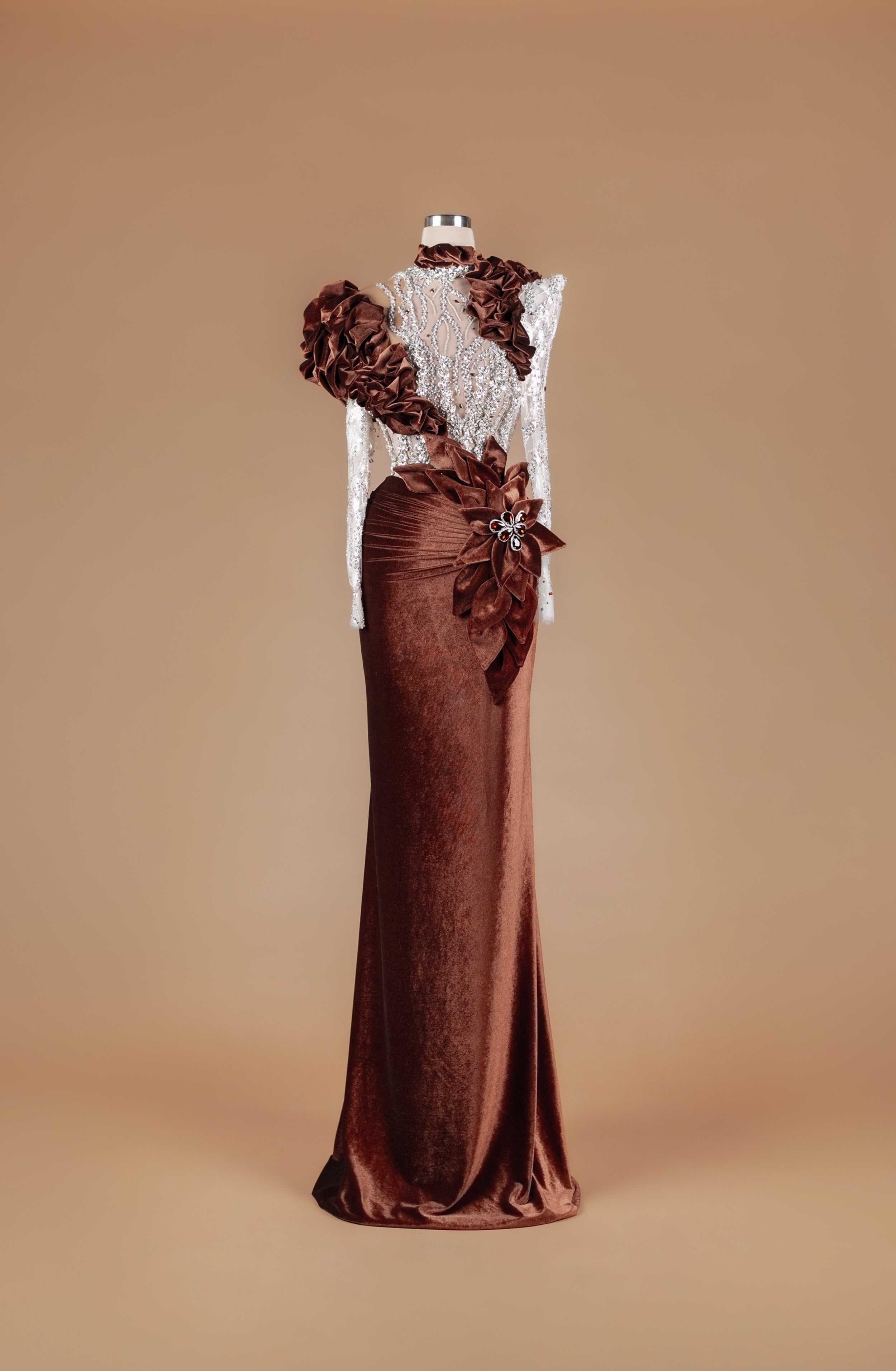 Sihëna Cocoa Rosette Sovereign — chocolate high-neck long-sleeve mermaid gown with crystal-beaded sheer bodice, velvet ruffles and 3D floral rosette.