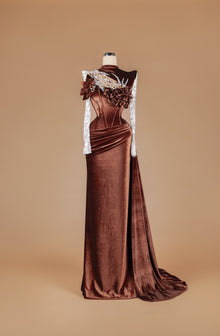Sihëna Bronze Petal Crown — chocolate high-neck long-sleeve velvet mermaid gown with amber and clear crystal beadwork, 3D floral and draped sash train.