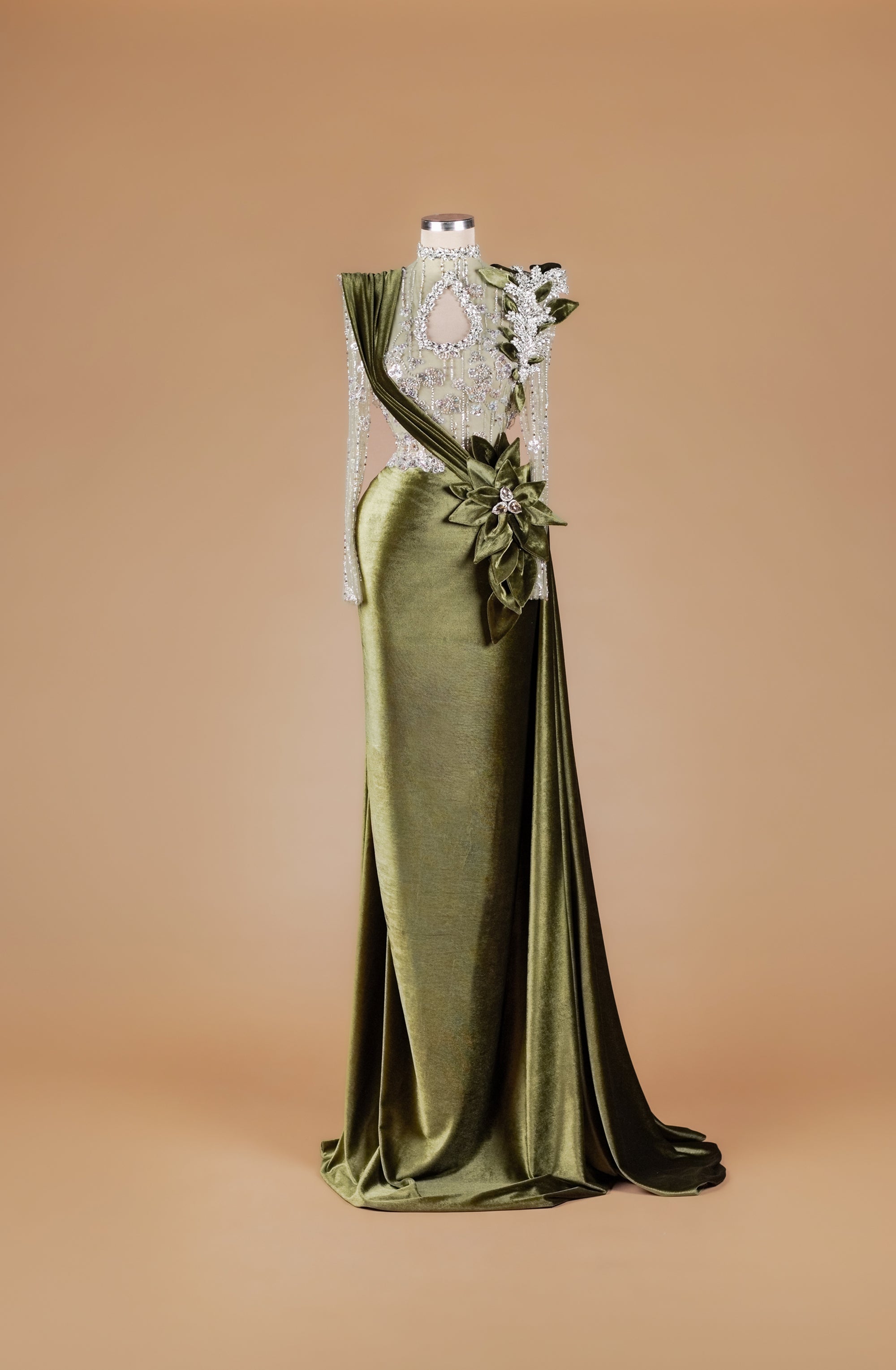 Sihëna Olive Crest Reverence — olive-green high-neck long-sleeve velvet mermaid gown with teardrop keyhole, crystal beadwork and 3D floral sash train.