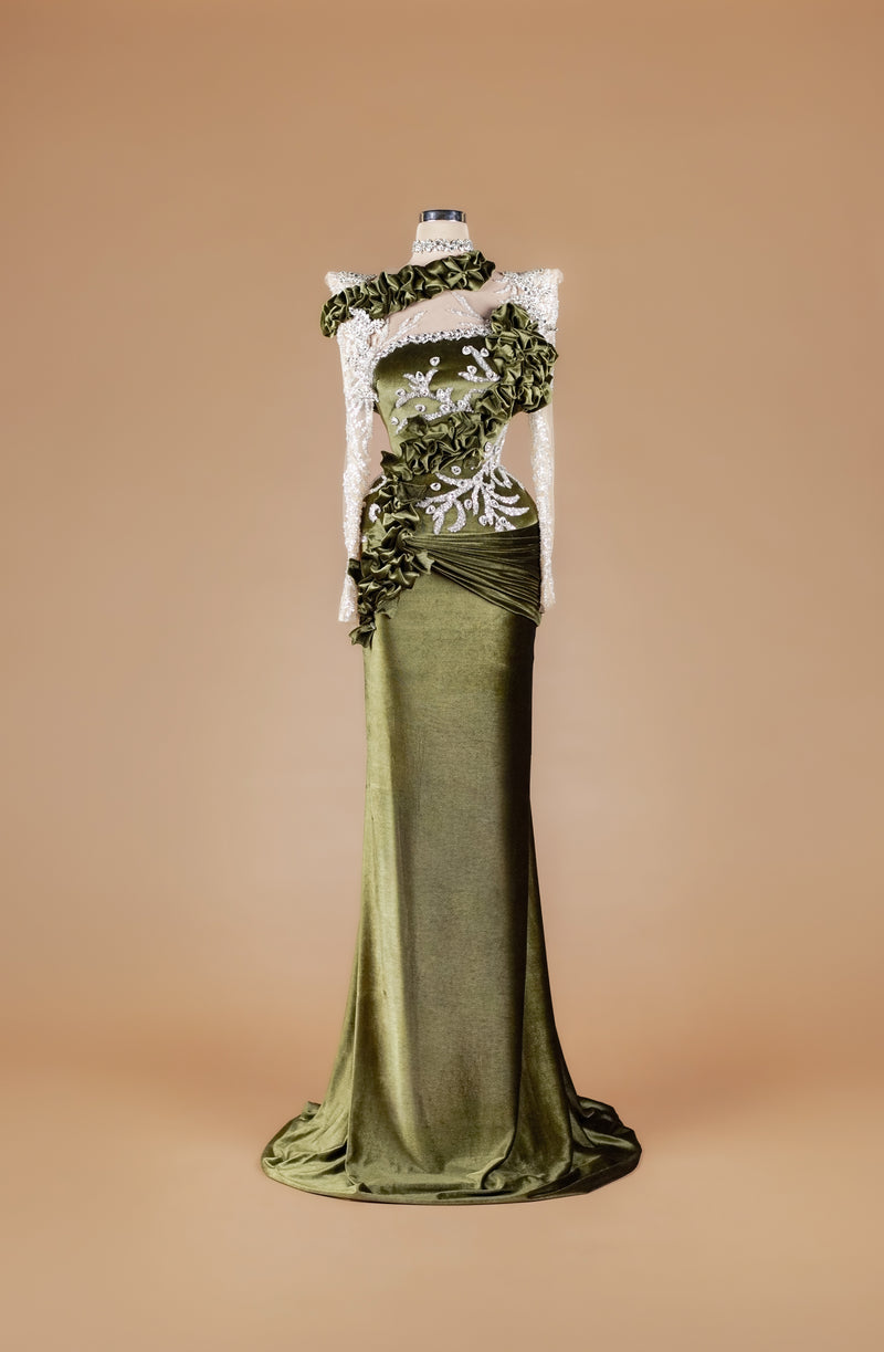 Sihëna Mossed Velvet Rhapsody — olive-green high-neck long-sleeve velvet mermaid gown with silver crystal appliqué, ruffled trim and draped train.