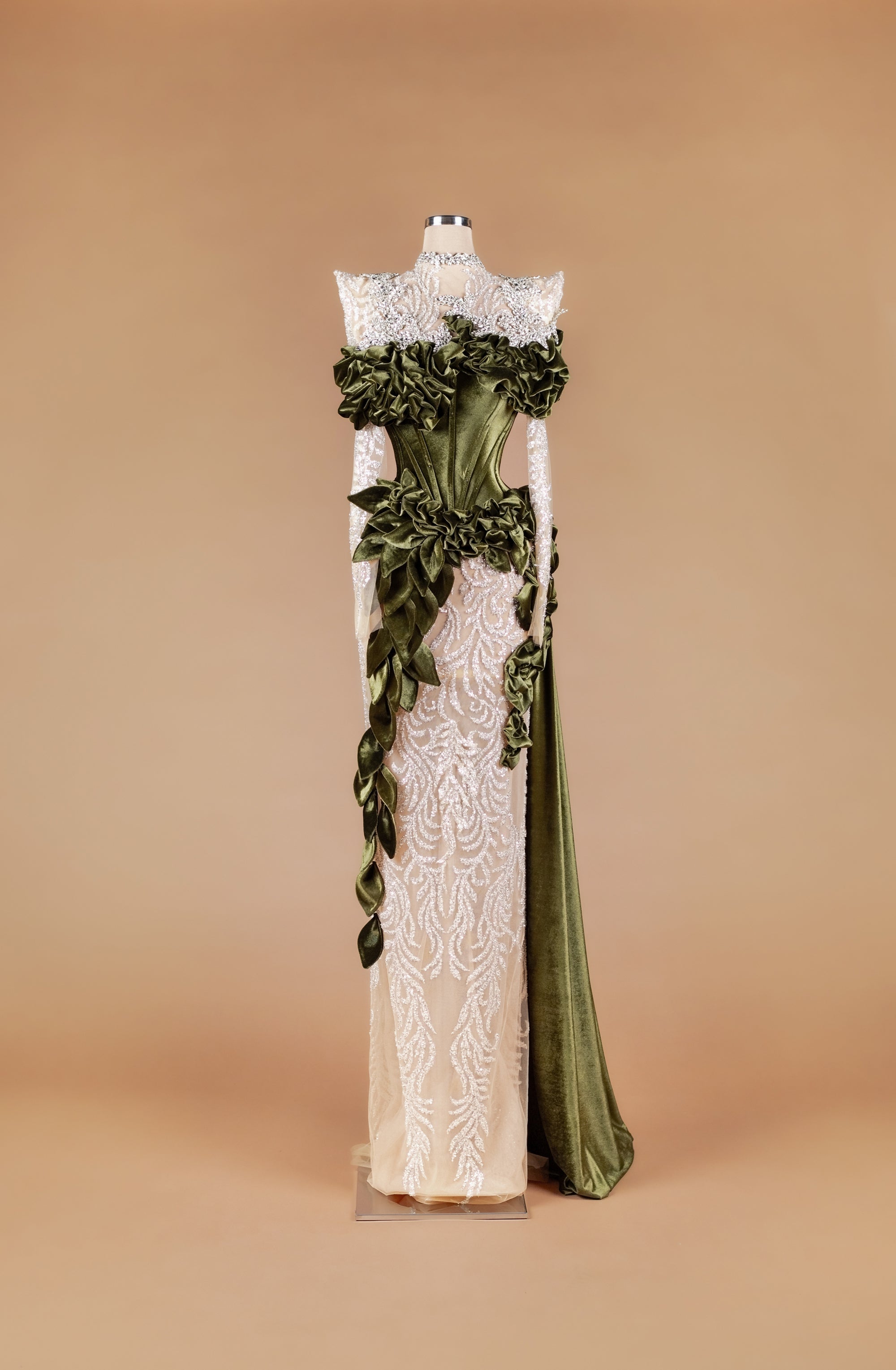 Sihëna Verdant Laurel Tapestry — olive-green high-neck long-sleeve mermaid gown with velvet corset, ruffled leaf detail and sheer ivory sequin skirt.