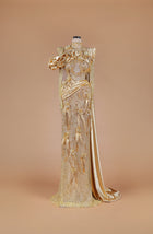 Sihëna Gilded Elysian Column — gold high-neck long-sleeve crystal-beaded illusion column gown with satin roses, feathers and gold floral embroidery.