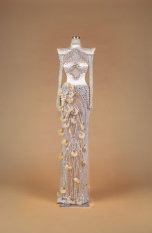 Sihëna Crystal Petal Tapestry — silver high-neck off-shoulder crystal-beaded illusion column gown with large midriff cutout and 3D organza petals.