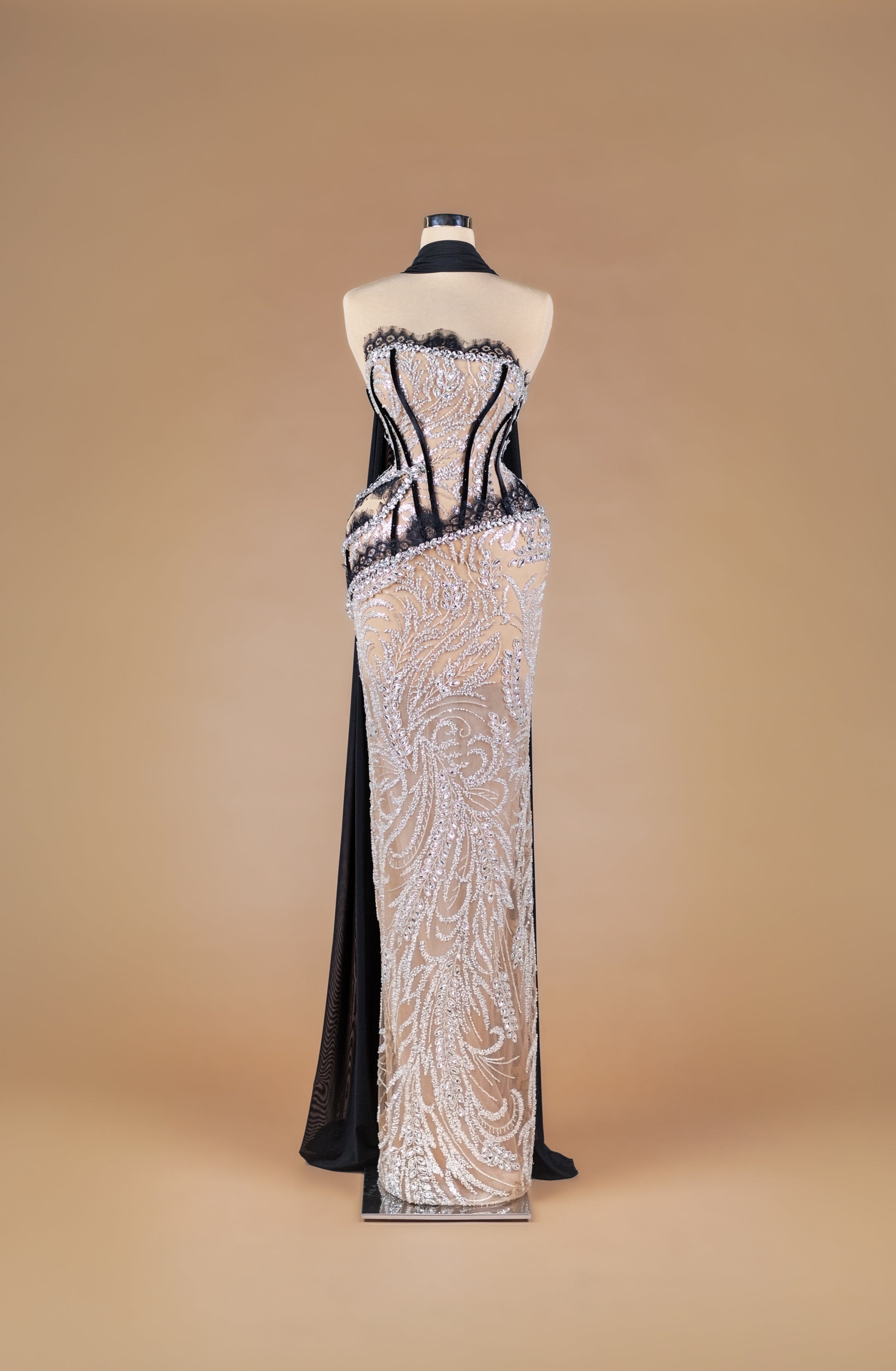 Sihëna Noir Lace Mirage — black strapless sheer corset column gown with silver crystal beadwork over nude illusion and black lace trim.