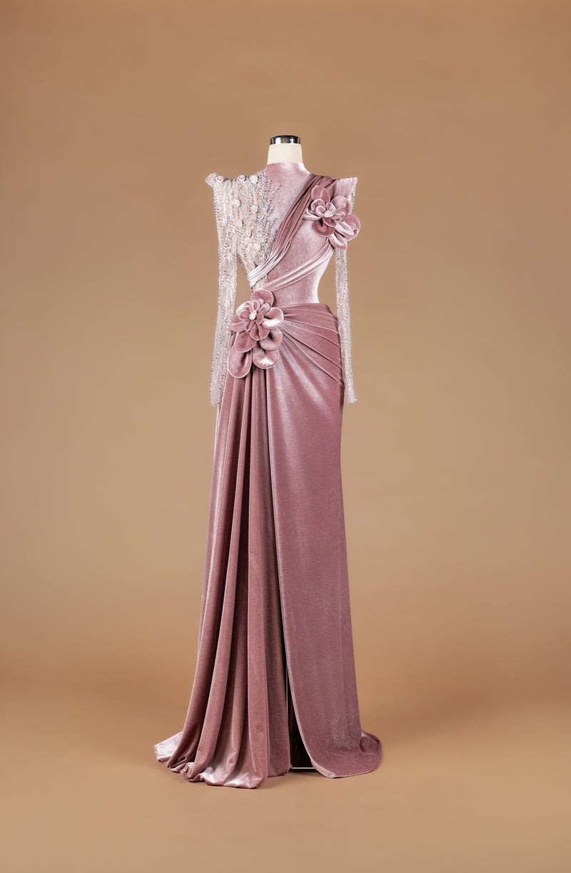 Sihëna Rose Velvet Garland — dusty-rose high-neck velvet column gown with sheer beaded illusion sleeve, 3D velvet roses and draped high-slit skirt.