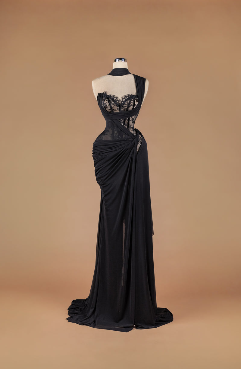 Sihëna Ebon Silhouette Whisper — black sweetheart sheer-lace corset column gown with draped crepe wrap, high slit and sweep train.