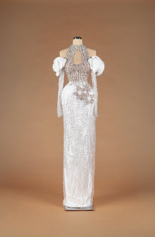 Sihëna Sunlit Harmony — ivory high-neck halter off-shoulder pearl and crystal beaded column gown with keyhole cutout and 3D floral waist appliqué.