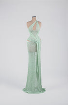 Sihëna Mint Mirage Ripple — mint one-shoulder sequin column gown with cutouts and a draped sash.