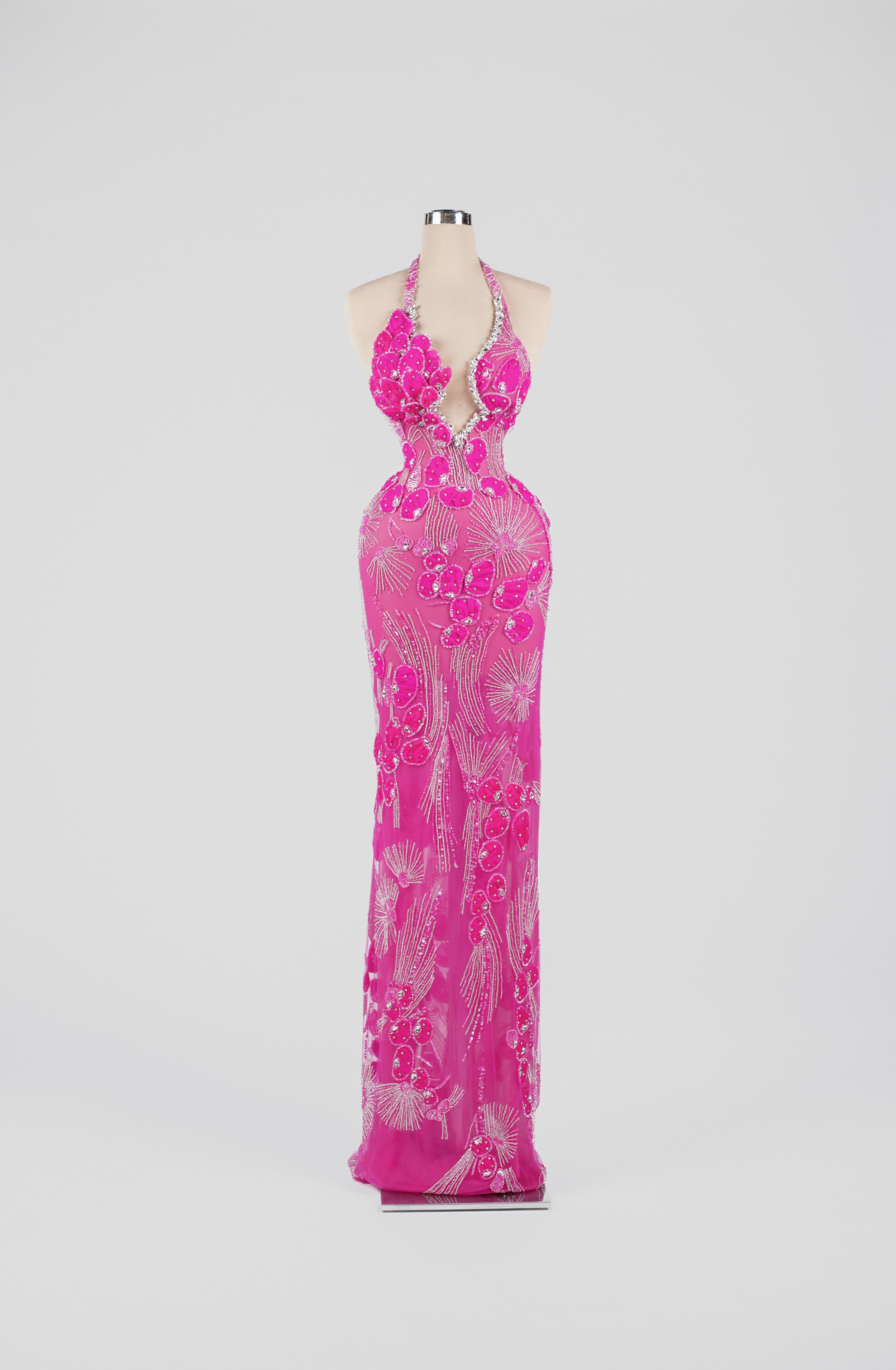 Sihëna Electric Fuchsia Bloom — fuchsia halter column gown with 3D-floral petals and crystal beadwork on sheer nude tulle.