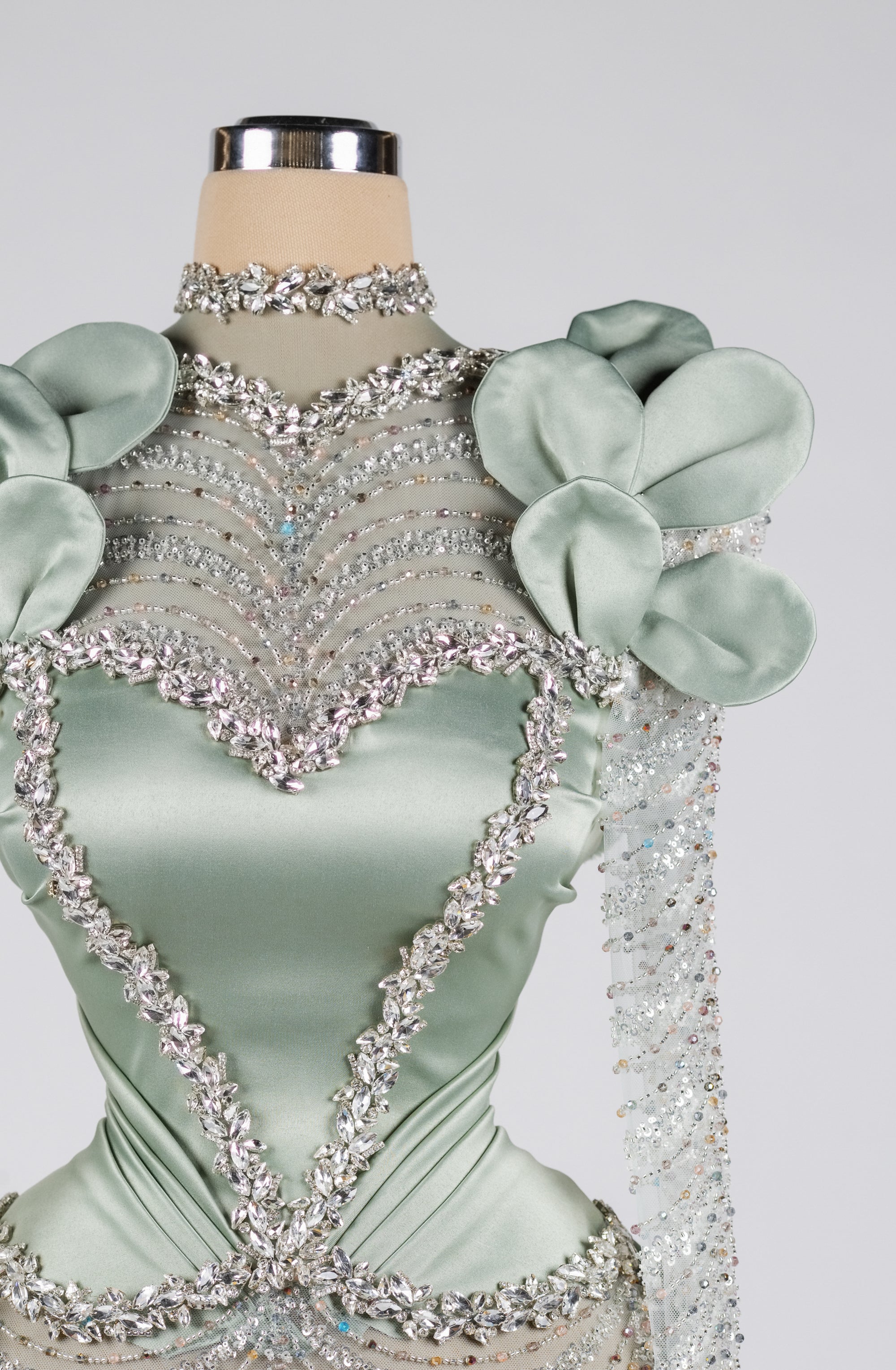 Sihëna Celestine Petal Crest — sage-green high-neck long-sleeve column evening dress