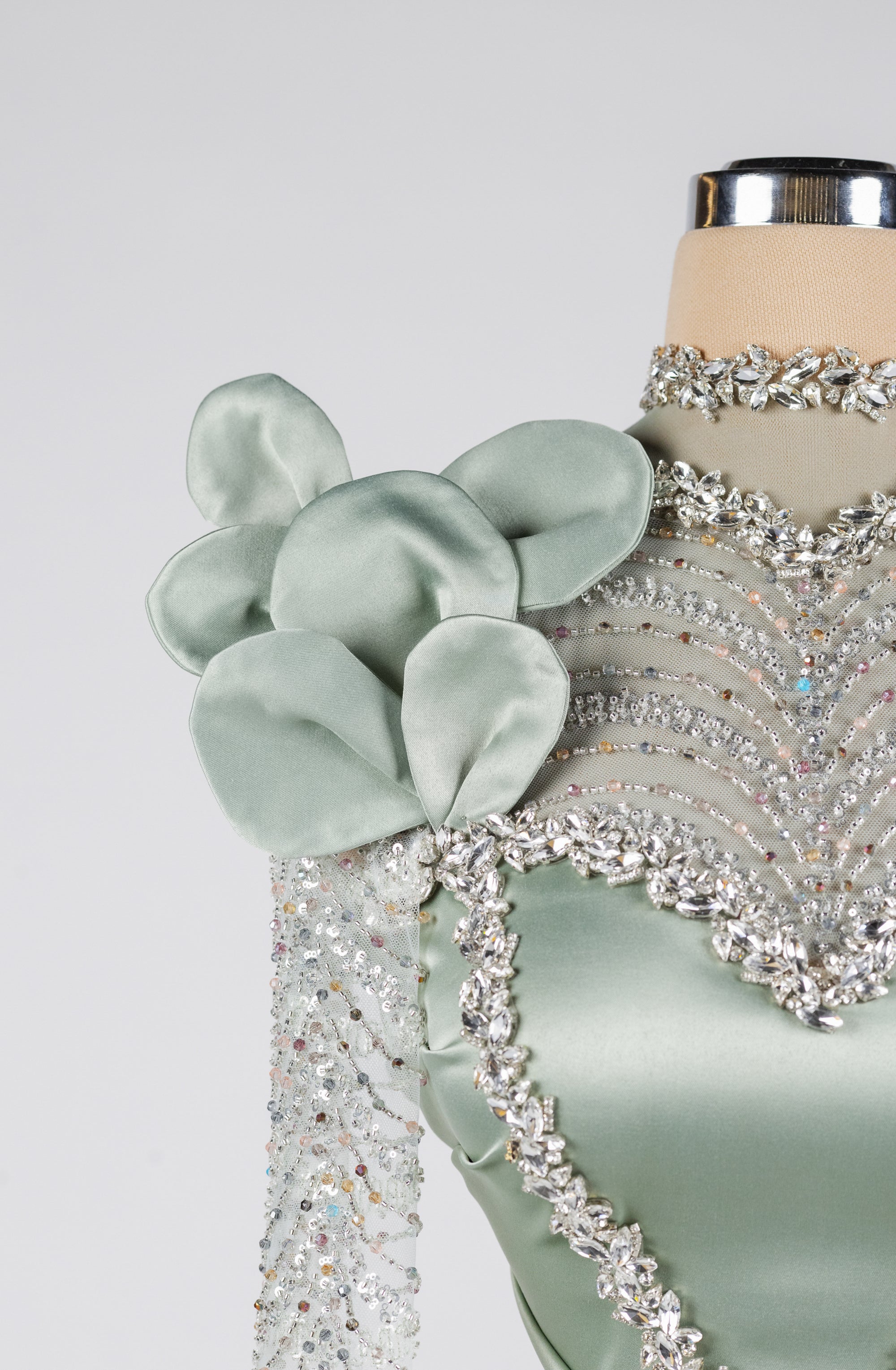 Sihëna Celestine Petal Crest — sage-green high-neck long-sleeve column evening dress