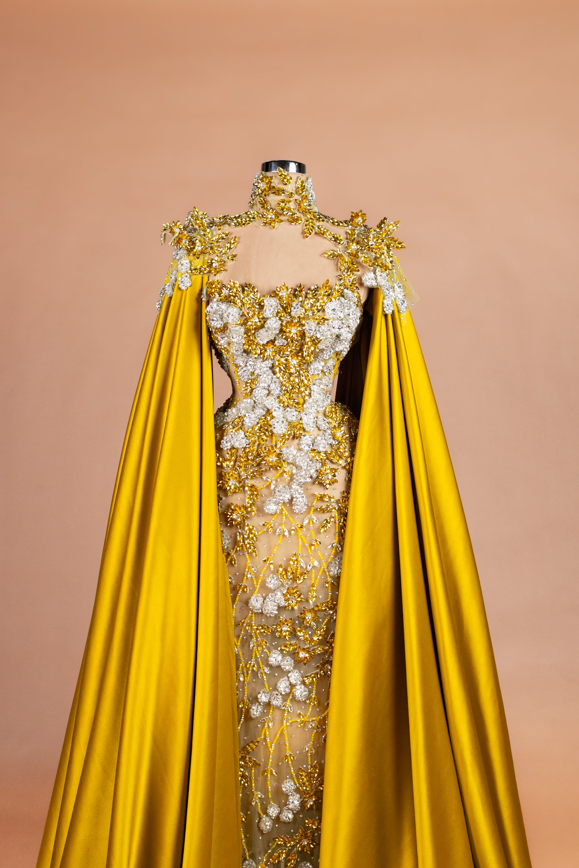Sihëna Ochre Blossom Cape — marigold high-neck cape-sleeve column evening dress