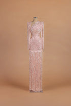 Sihëna Blush Cadence — blush asymmetric long-sleeve column gown with sequin embellishment.