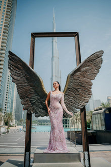 Sihëna Heather Twilight — lilac one-shoulder long-sleeve column gown with crystal-beaded floral embroidery.