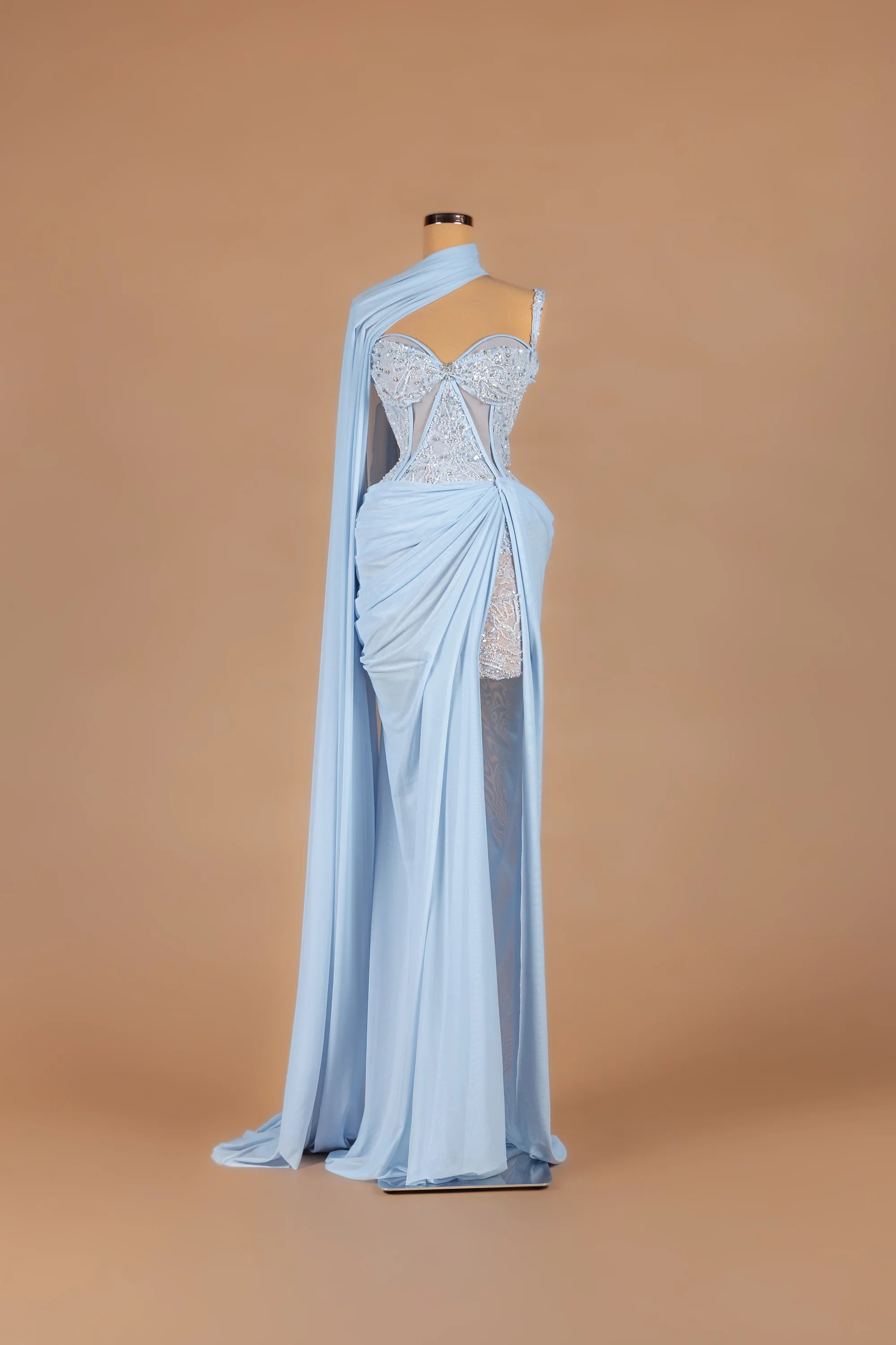 Sihëna Moonstone Drift — powder-blue sweetheart sleeveless fitted gown with a draped shoulder cape.