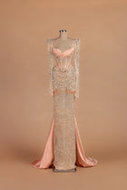 Sihëna Peony Sautoir — blush sweetheart long-sleeve sheath gown with cascading bead-strand swags.