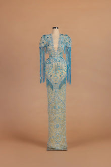 Sihëna Turquoise Tide — teal v-neck short-sleeve column gown with beaded embroidery.
